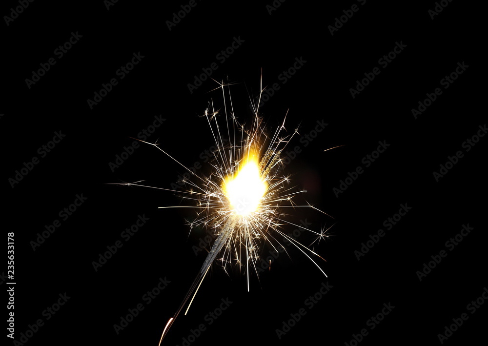 Obraz premium Ignited sparkler isolated on black background with clipping path