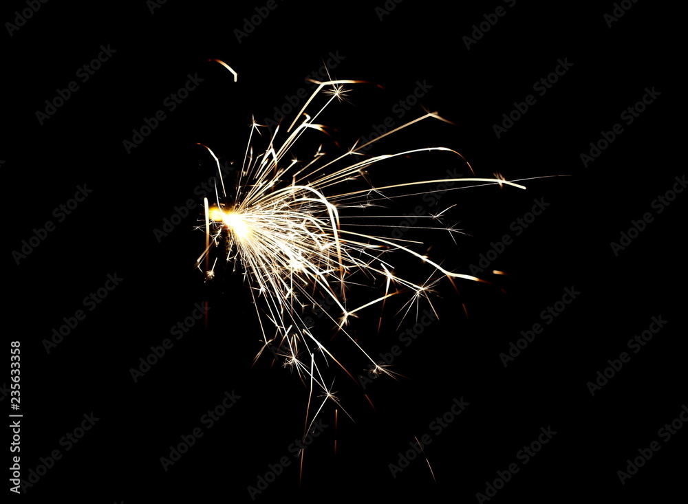 Fototapeta premium Ignited sparkler isolated on black background with clipping path