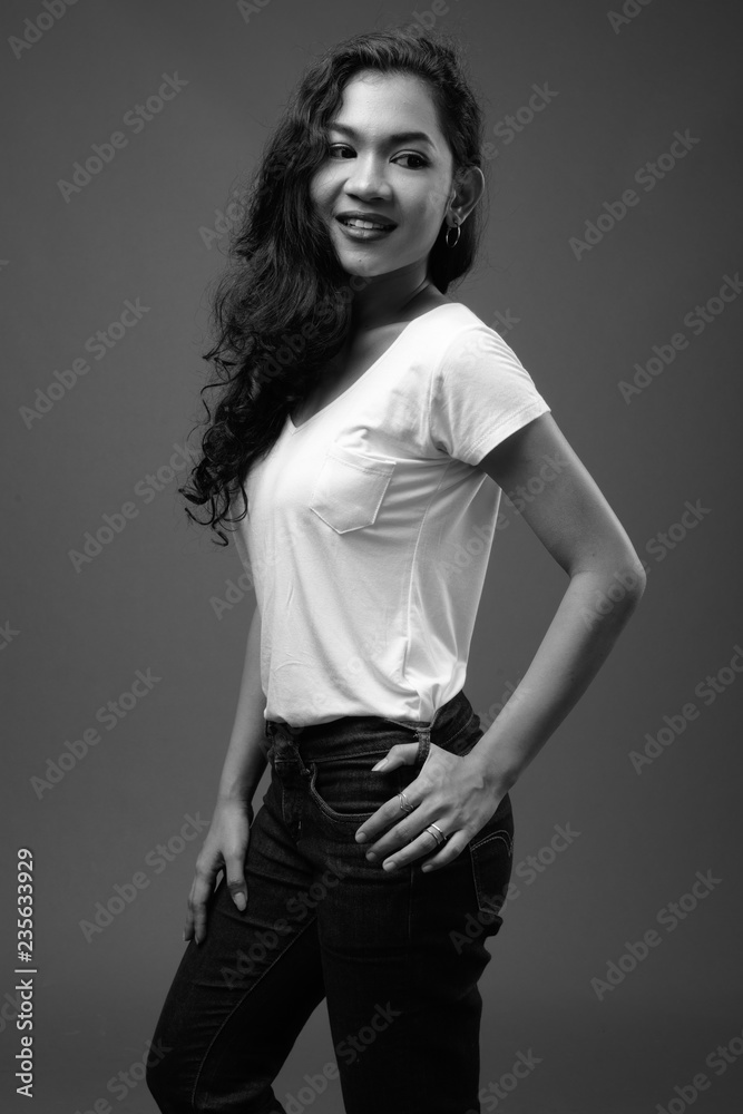 Young beautiful Asian woman studio portrait in black and white Young beautiful Asian woman studio portrait in black and white