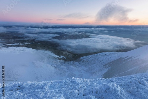 Svydovetsky ridge with the highest peak Blyznytsia covered with snow in the morning twilight, Carpathian biosphere reserve, Ukraine. Svydovetsky massif of the Carpathians in the winter