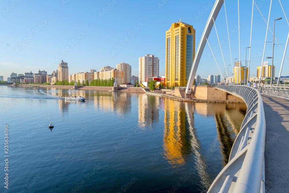 Fototapeta premium view of Astana city taken over the river from bridge