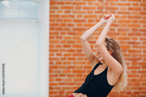 Young woman dancing in a dance studio