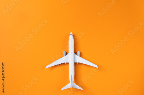 Image of airplane isolated on empty orange background