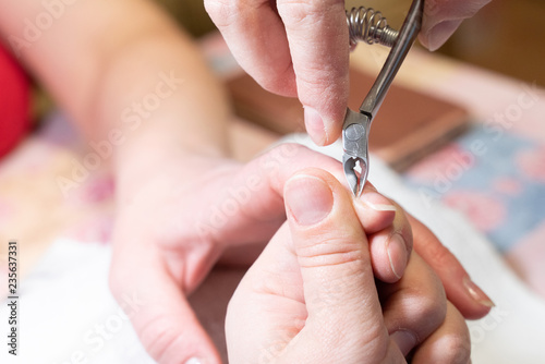 woman doing manicure. the process of creating a manicure hands close-up. nail care