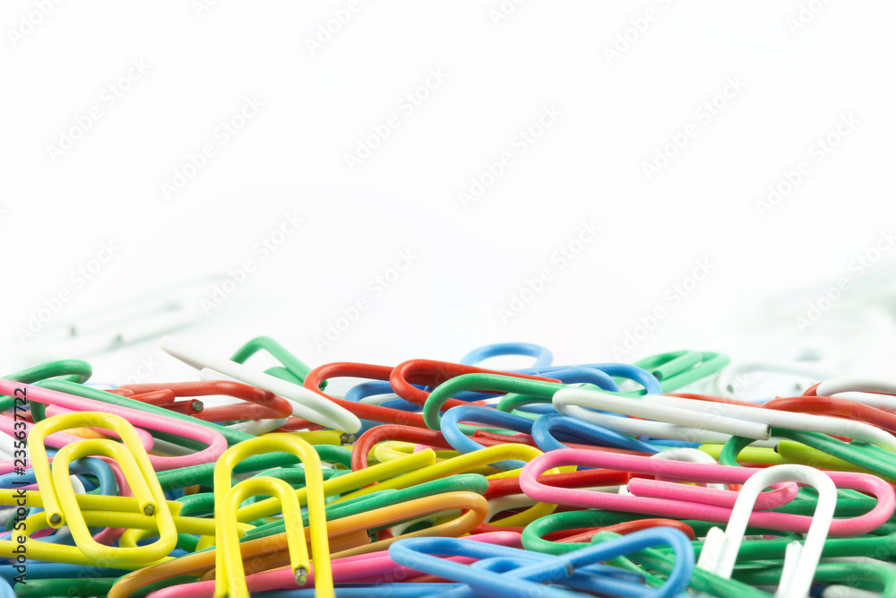 Paper clips colorful with copy space on top on white background. Paper clips colorful with copy space on top on white background.