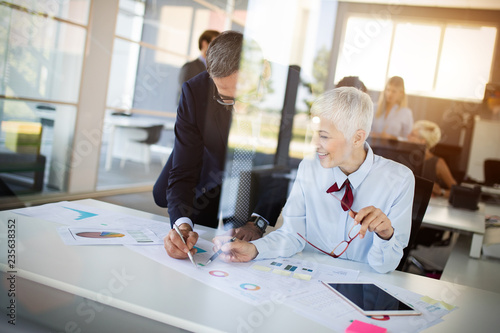 Businesspeople discussing together in conference room during meeting at office photo