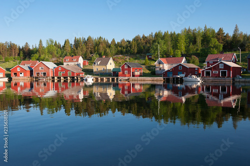 Red sweden houses in trysunda Island, Högakusten, northernn Sweden photo