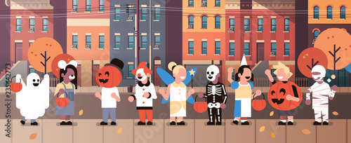 kids wearing monsters costumes walking town home buildings front view holiday concept tricks or treat happy halloween cartoon character full length horizontal banner flat