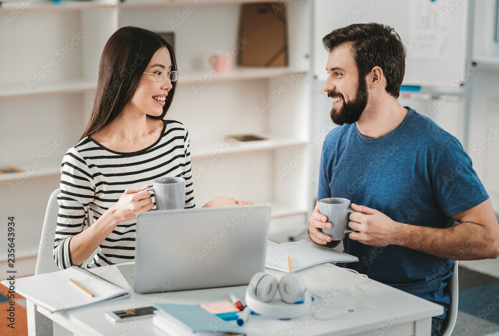 Fototapeta premium Cute couple drinking coffee in the morning together