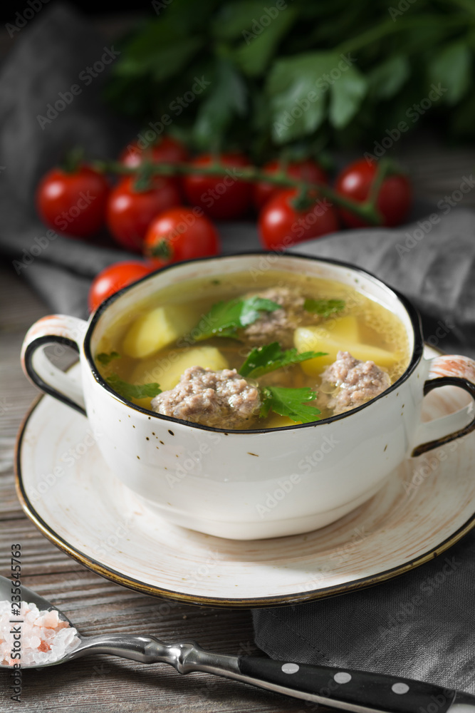 Soup with meatballs. Rustic style Soup with meatballs. Rustic style