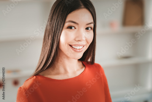 Close up of appealing charming dark-haired woman