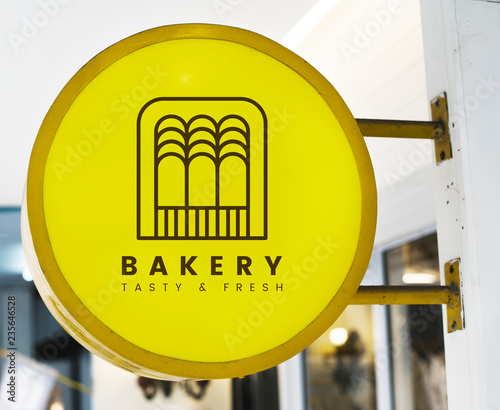 Bakery store&#39;s yellow shop sign mockup