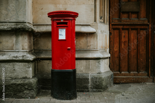 Photography Iconic red British mailbox in a city