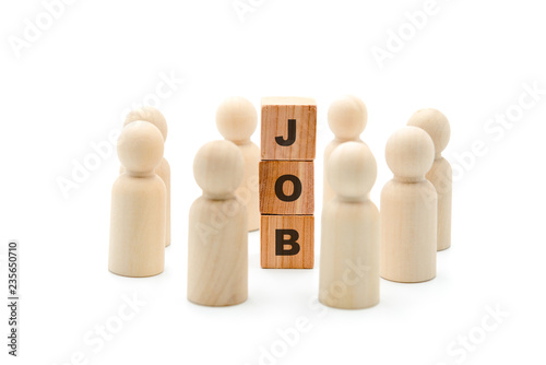 Wooden figures as business team in circle around word JOB