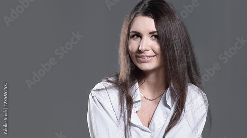 smiling creative woman sitting on an office chair in a work break