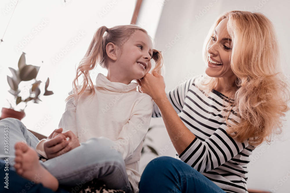 Cheerful mother and daughter enjoying a day together Cheerful mother and daughter enjoying a day together