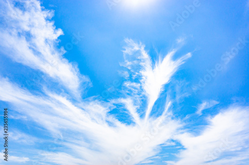 Sunshine clouds during morning light. Blue  white pastel heaven  soft focus lens flare sunlight. Abstract blurred cyan gradient of peaceful nature.