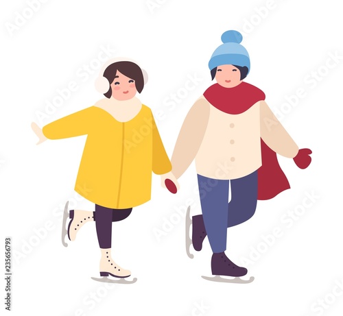 Pair of cute girls holding hands and ice skating together
