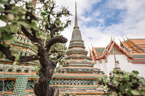 Amazing view through the trees at Wat Pho. Temple of the Reclining Buddha in Bangkok, Thailand.