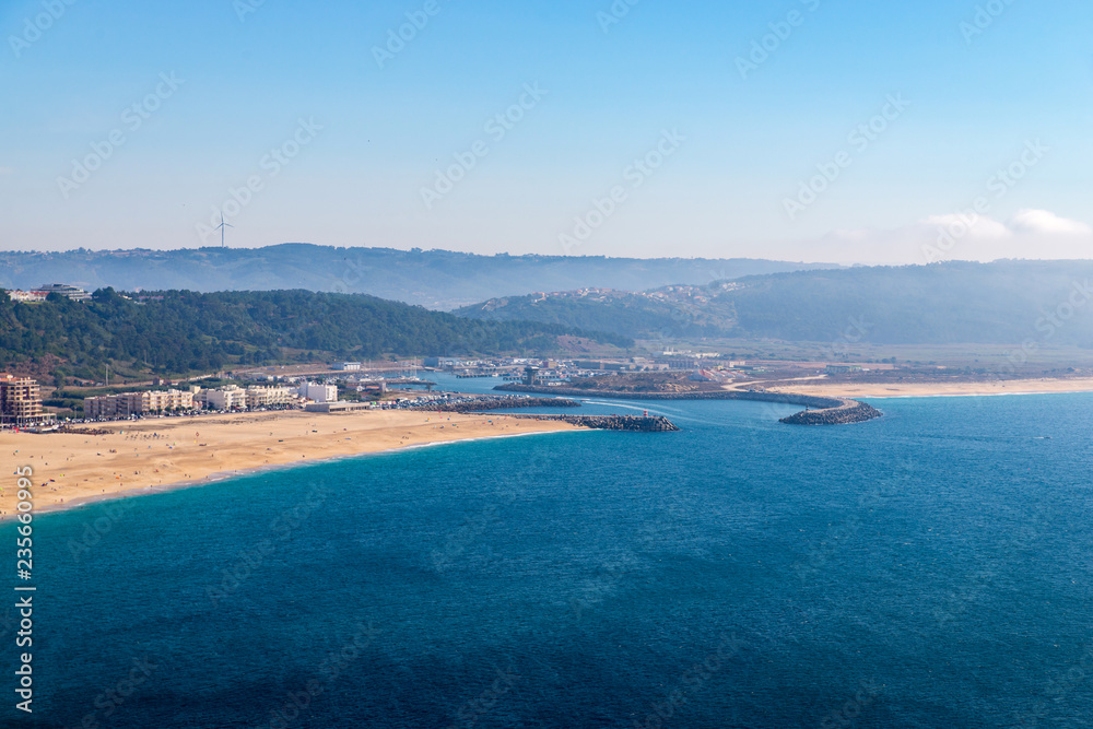 From the high point of the Nazare we can see the beach the sea and the village Nazare, Portugal