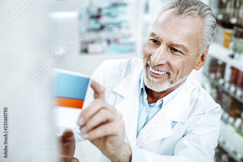 Wallpaper Mural Cheerful mature pharmacist working with great pleasure Torontodigital.ca