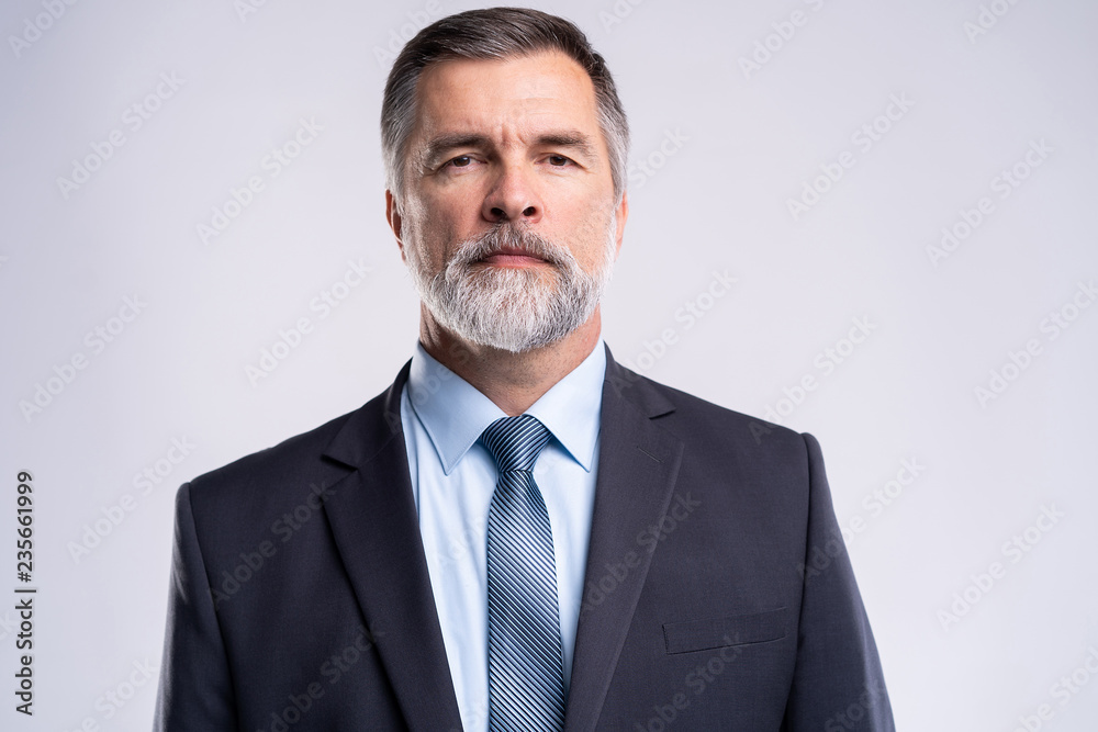 Happy satisfied mature businessman looking at camera isolated on white background. Happy satisfied mature businessman looking at camera isolated on white background.