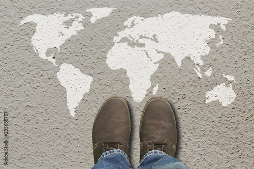 Grey fashion shoes on world map background