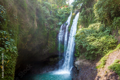 Famous Aling-Aling waterfall without people among green tropical jungle on the north of Bali island  Indonesia