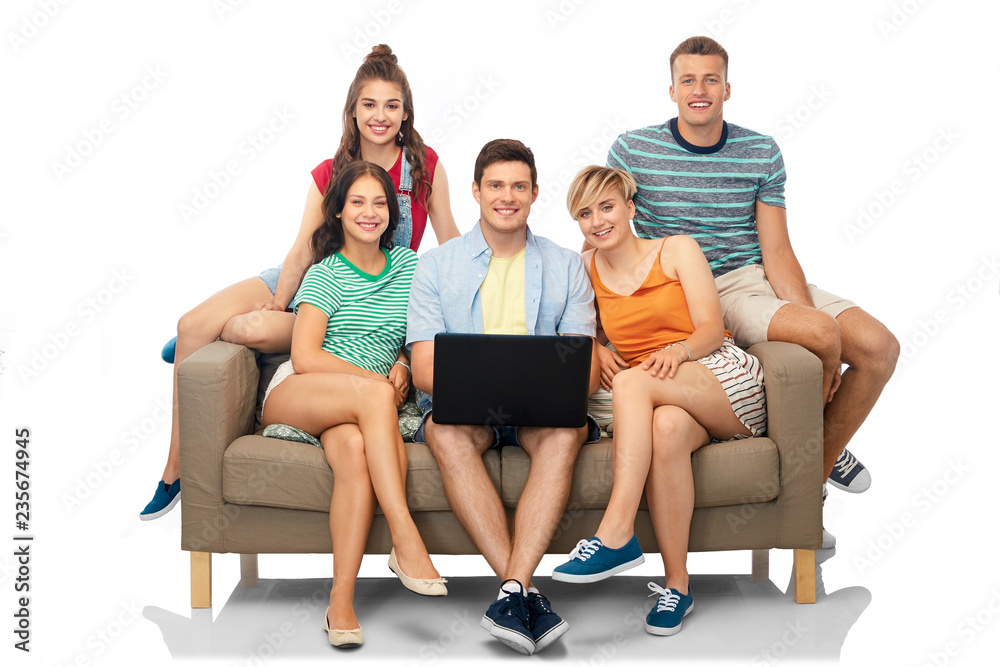 friendship, leisure and technology concept - group of happy smiling friends with laptop computer sitting on sofa over white background friendship, leisure and technology concept - group of happy smiling friends with laptop computer sitting on sofa over white background