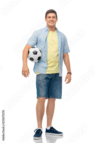 sport, leisure and people concept - smiling young man with soccer ball over white background