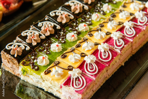 Catering sweets, closeup of various kinds of cakes on event or wedding reception - selective focus