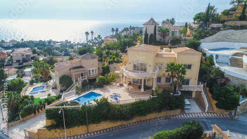 Photography Big villa with swimming pool situated on sea side drone shoot