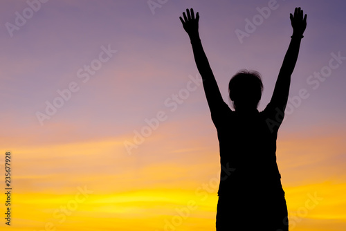 Young woman relaxing with sunset