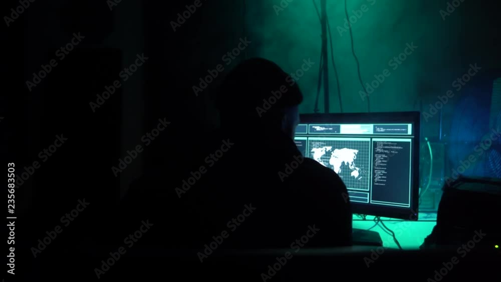 Wanted hackers coding virus ransomware using laptops and computers. Cyber attack, system breaking and malware concept. Wanted hackers coding virus ransomware using laptops and computers. Cyber attack, system breaking and malware concept.