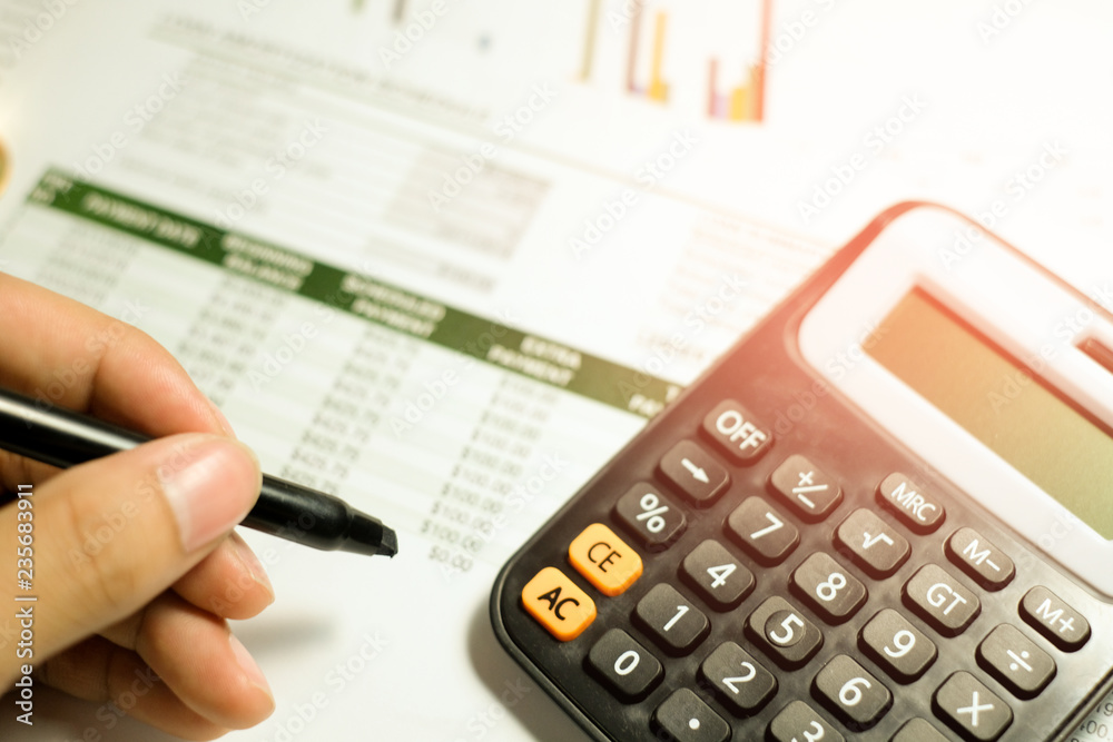 Close up woman using calculator with space for you design, selective focus. Close up woman using calculator with space for you design, selective focus.