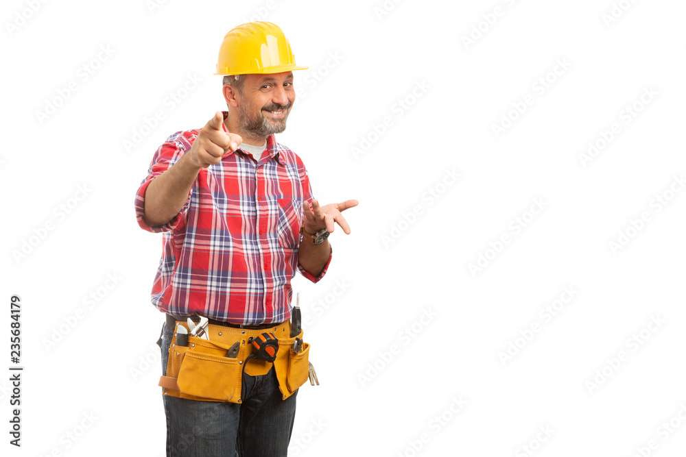 Constructor pointing at camera with asking gesture. Constructor pointing at camera with asking gesture.