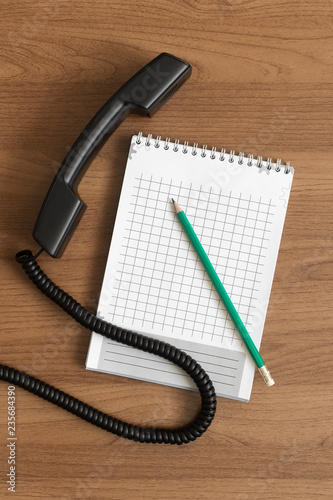 Handset, pencil and notepad