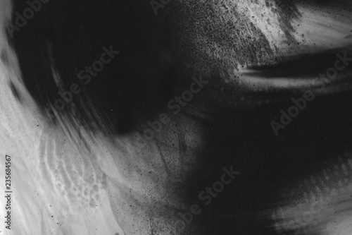 Abstract ink background. Marble style. Black paint stroke texture on white paper. Wallpaper for web and game design. Grunge mud art. Macro image of pen juice. Dark Smear.