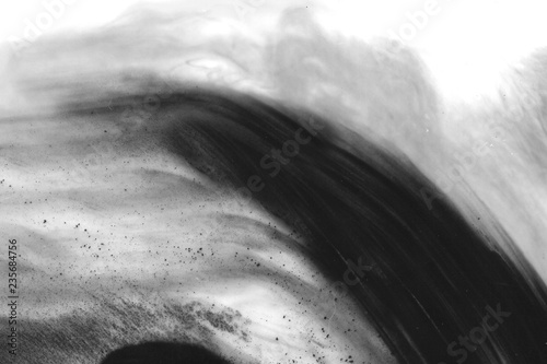 Abstract ink background. Marble style. Black paint stroke texture on white paper. Wallpaper for web and game design. Grunge mud art. Macro image of pen juice. Dark Smear.