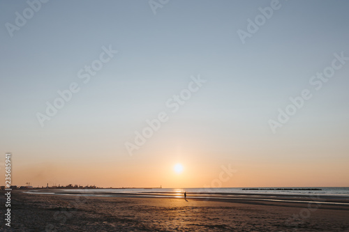 Ocean view at sunset over the sand dunes on the North sea.