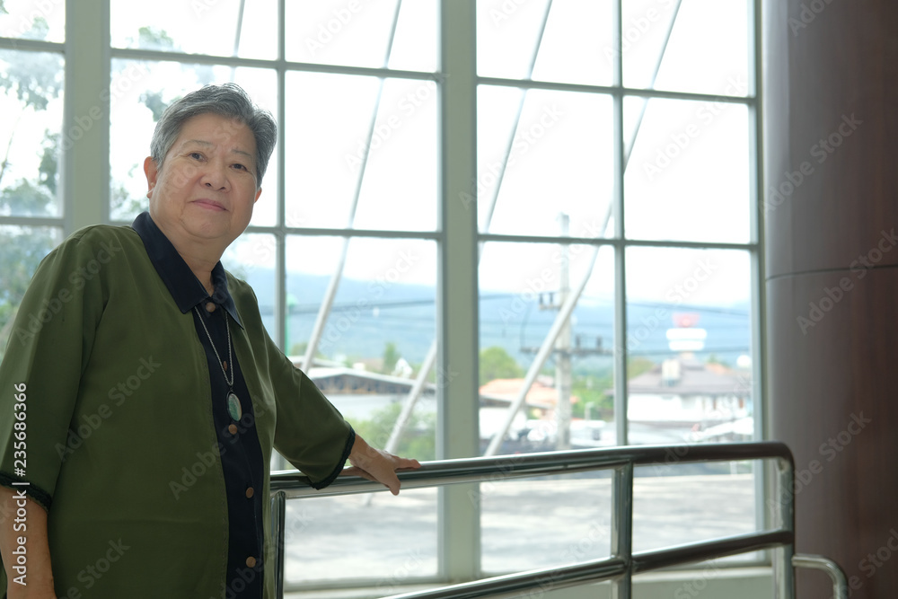 asian elder woman resting relaxing on balcony terrace. elderly senior leisure lifestyle asian elder woman resting relaxing on balcony terrace. elderly senior leisure lifestyle