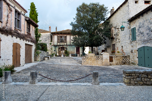 Fototapeta Naklejka Na Ścianę i Meble -  Spring sunshine on empty streets in tranquil Pujols, Lot-et-Garonne, France. Often busy with visitors Pujols is a member of Les Plus Beaux Villages de France association.
