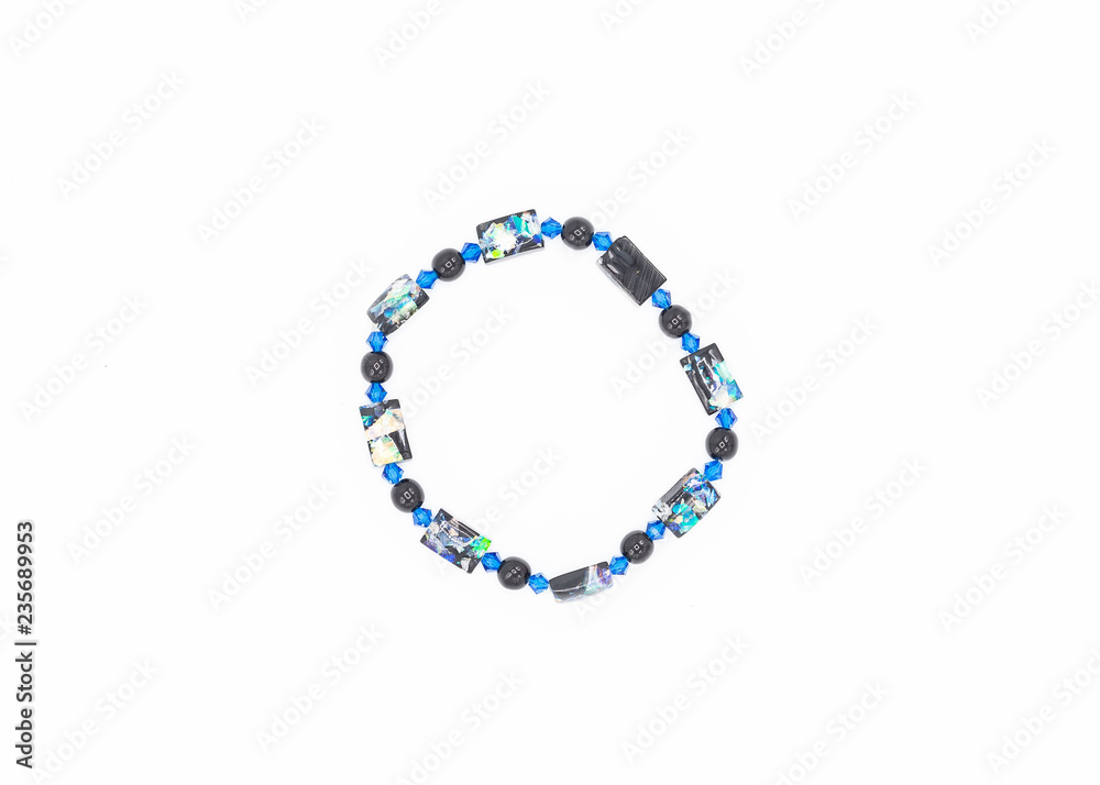 Fototapeta premium multiple colored and sized beads bracelet on white background