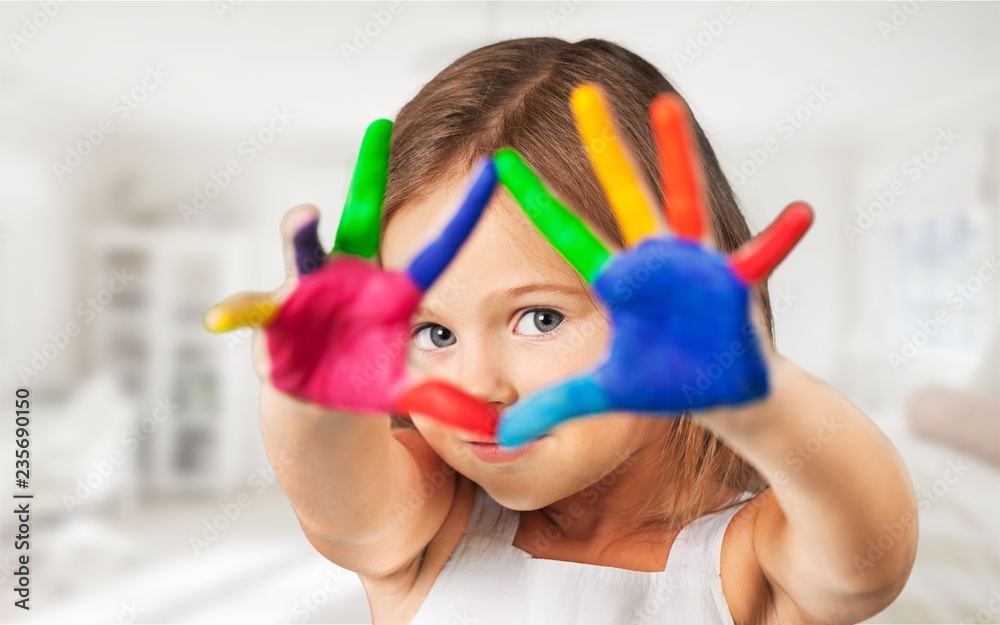 Cute little girl with colorful painted hands on  background - obrazy, fototapety, plakaty 