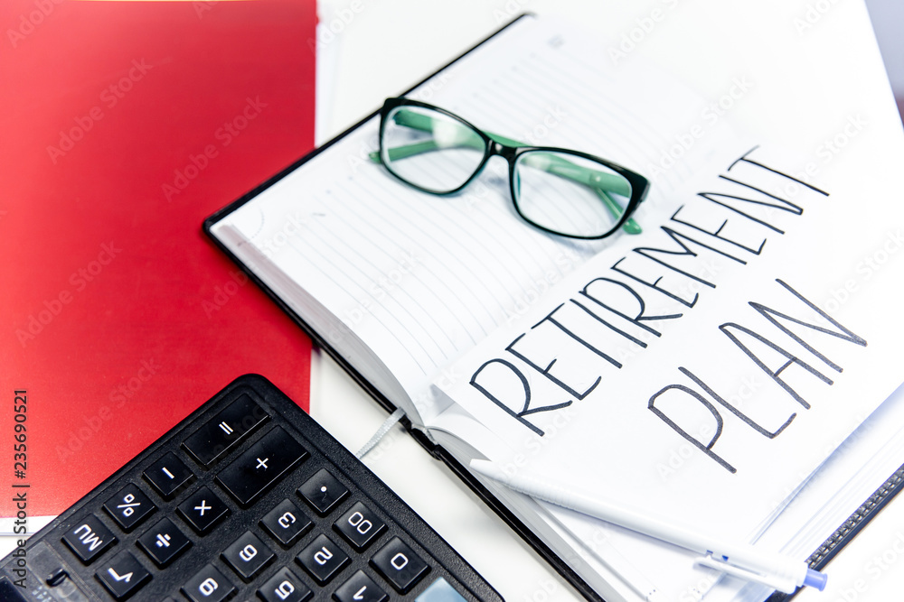 retirement fund concept - money and a calculator retirement fund concept - money and a calculator