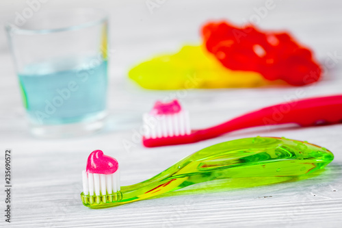 children s toothbrush oral care on wooden background