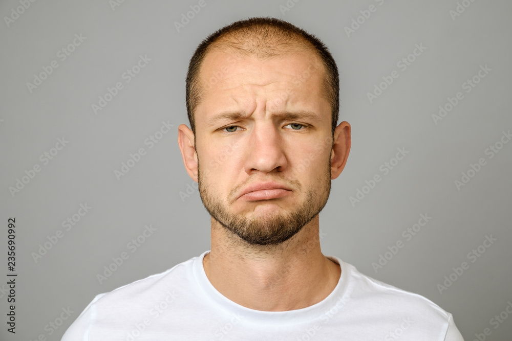 Portrait of unhappy handsome guy with beard Portrait of unhappy handsome guy with beard