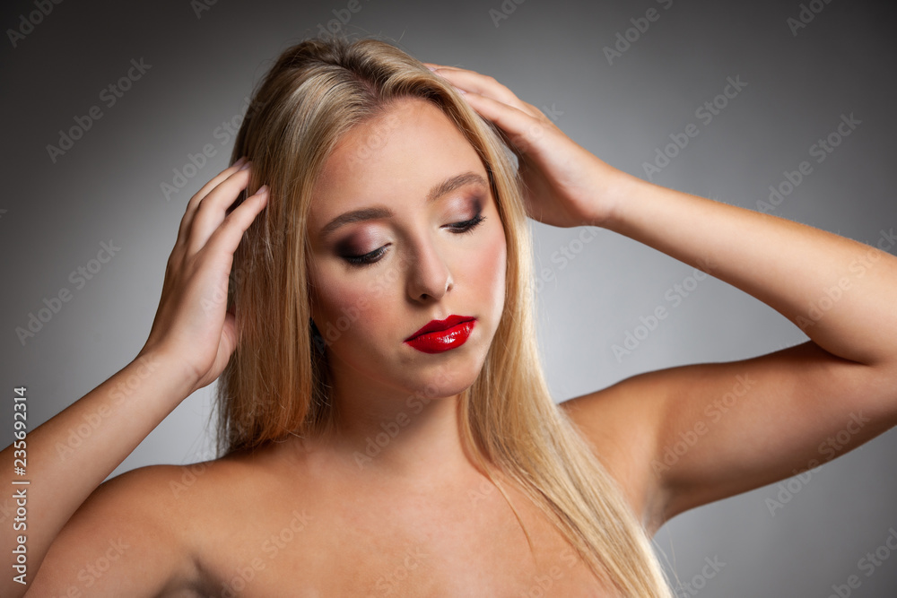 Beauty portrait of a cute blonde caucasian woman with green eyes Beauty portrait of a cute blonde caucasian woman with green eyes