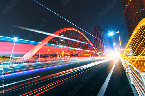 abstract image of blur motion of cars on the city road at night   Modern urban architecture in tianjin  China