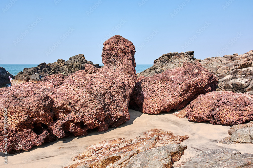 India. Goa State. Stone heaps on the beach Kerem